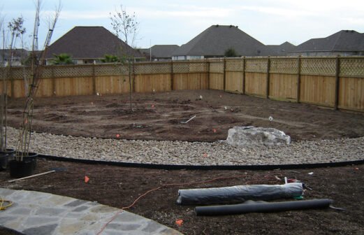 We have graded this lot, created a dry creek bed  and a flagstone walkway and are starting to plant trees--Southbank